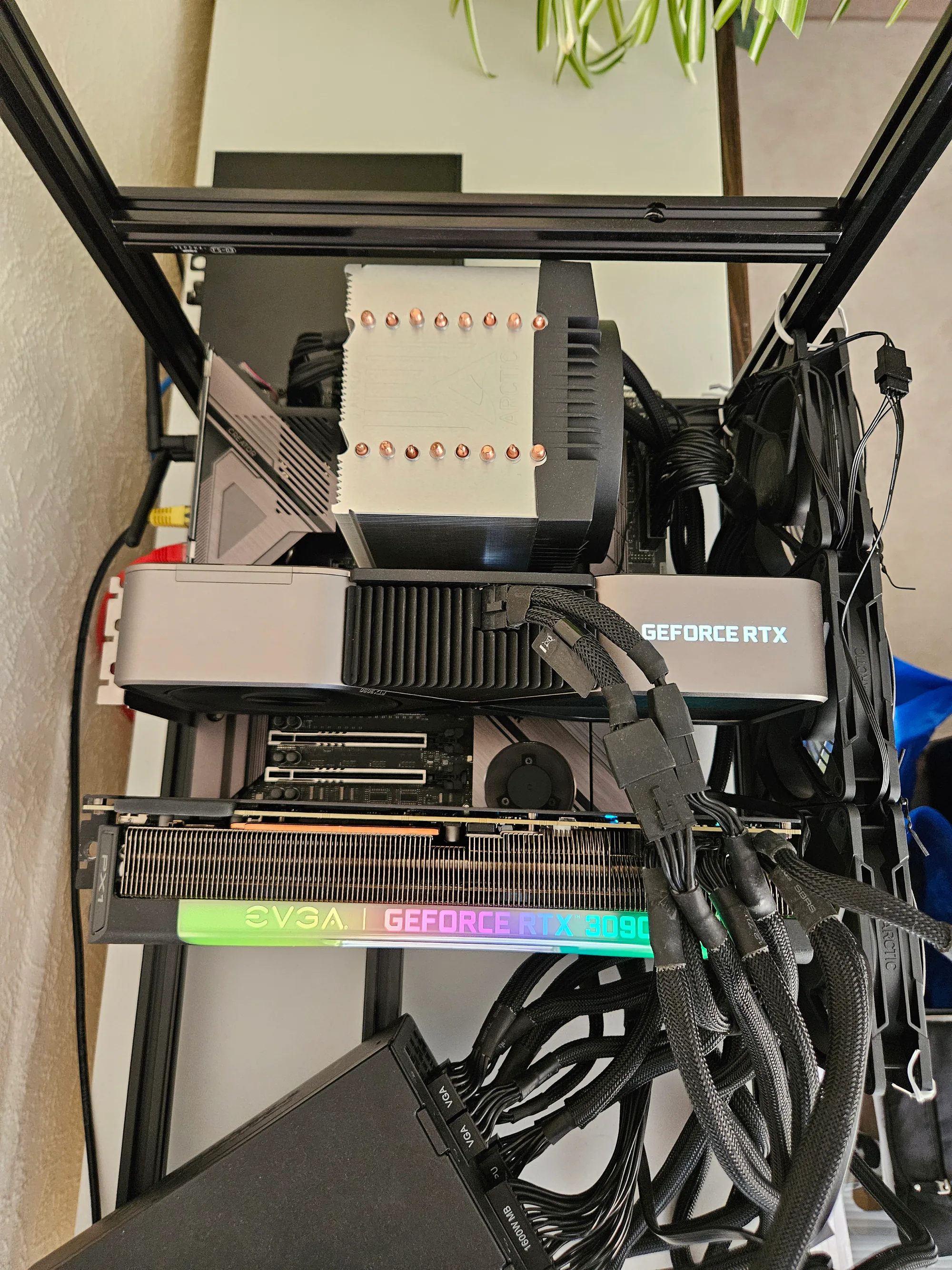 Open-air local AI workstation with an RTX 3090 Founders Edition, EVGA RTX 3090 FTW3, large Threadripper Pro CPU cooler and several frame-mounted fans.